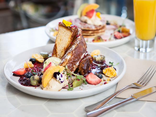 The French brioche toast, served with crystalized hazelnut, strawberry gel, fresh and freeze dried fruit, blood orange sorbet, white chocolate crumb and a drizzle of salted caramel. Picture: Supplied