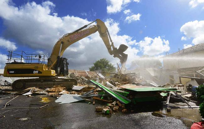 DOWN SHE GOES: Demolition has started on the One Mile Hotel but what exactly will be built on the site remains a mystery. Picture: DAVID NIELSEN