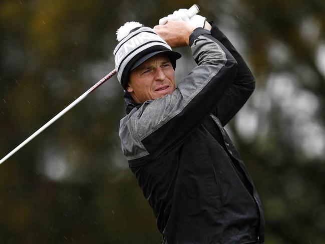 Australian Masters Pro Am at Royal Melbourne Golf Club. Essendons Brendon Goddard during todays rain soaked pro am. Pic Michael Klein. Wednesday November 13, 2013.