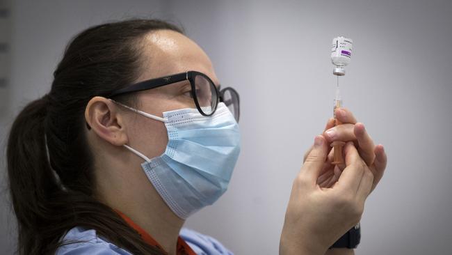 A member of the vaccine team prepares a syringe with a dose of the AstraZeneca/Oxford Covid-19 vaccine, at an NHS Scotland vaccination centre. Picture: AFP