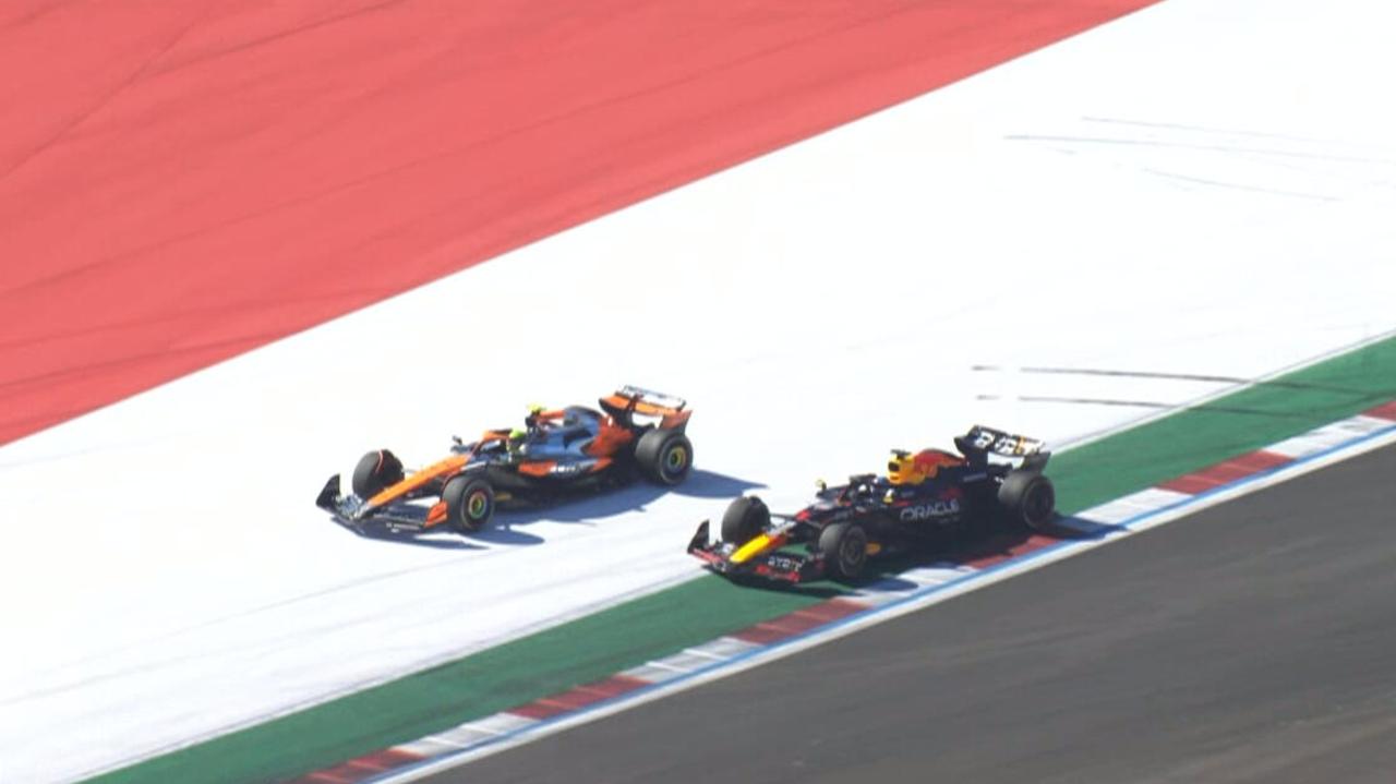 Lando Norris overtakes Max Verstappen.