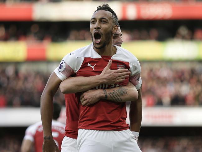 Arsenal's Pierre-Emerick Aubameyang celebrates after scoring his side's opening goal from the penalty spot during the English Premier League soccer match between Arsenal and Tottenham Hotspur at the Emirates Stadium in London, Sunday Dec. 2, 2018. (AP Photo/Tim Ireland)