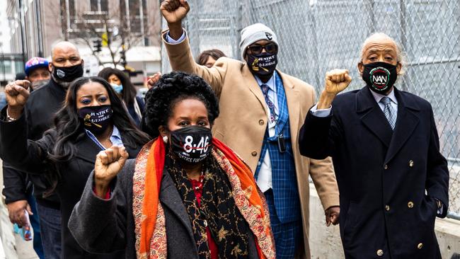 George Floyd’s family and Reverend Al Sharpton, right, arrive at the courthouse in Minneapolis on Tuesday. Picture: AFP