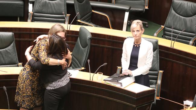 Greens leader Cassy O'Connor and Labor's Ella Haddad celebrate in State Parliament as Attorney General Elise Archer stands after the passage new legislation about gender law reform. Picture: DAVID KILLICK