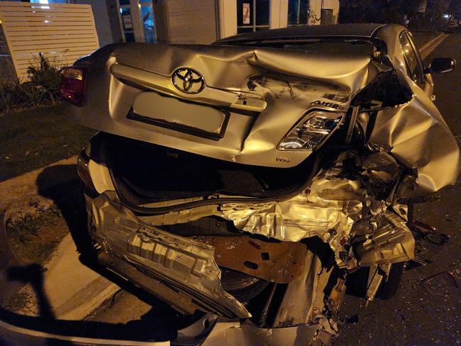 A car in Coolum Beach was found damaged after a hit-and-run, with the driver allegedly fleeing the scene. Photo: Lewis Jaenke