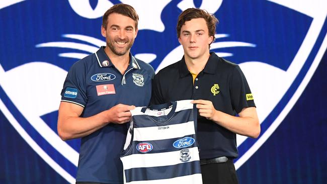 Former Geelong star Corey Enright presenting Jordan Clark with his jumper at last year’s national draft.