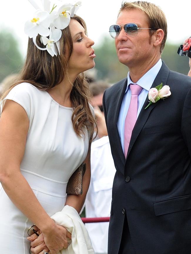 Liz Hurley and Shane Warne in the mounting yard.