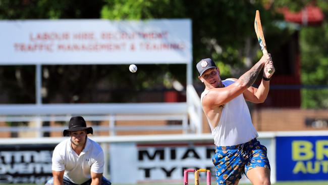 26th January 2021 - Gold Coast Titans player Jarrod Wallace belts a ball to the boundary during action at Pizzy park as Bears Player Hayden Schwass watches on as the Bears took on the Gold Coast Titans in an Australian Day cricket clash. Photo: Scott Powick NEWSCORP