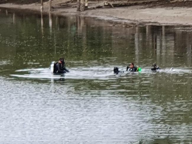 Police divers searching Tallebudgera Creek for evidence. Picture: Chris McMahon