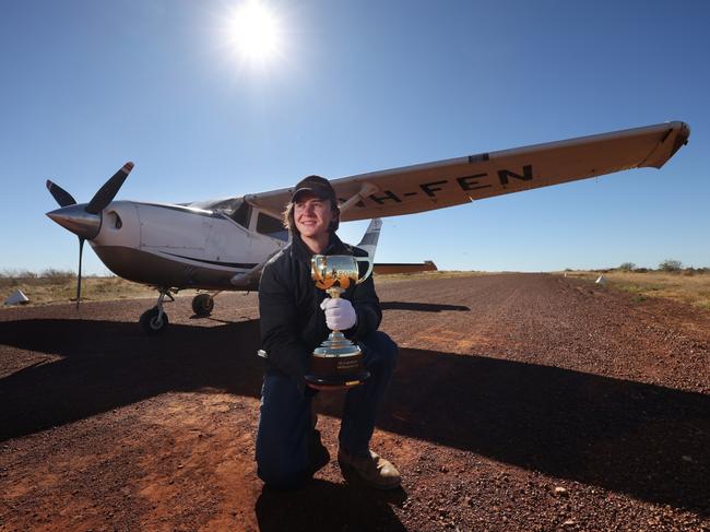 Lexus Melbourne Cup trophy in Tennant Creek with a local pilot as part of its 2024 tour. Picture: Alex Coppel