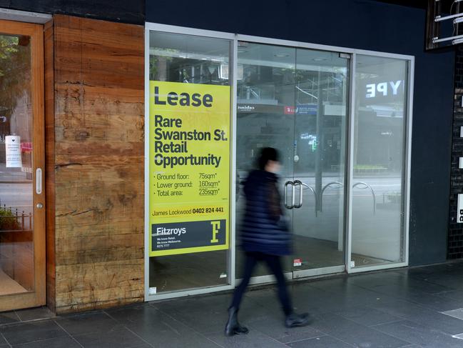 MELBOURNE, AUSTRALIA - NewsWire Photos OCTOBER 6, 2020: A pedestrian walks past closed shops along Swanston Street. Melbourne's retail heart has been closed after the Coronavirus pandemic forced the city into lockdown. Picture: NCA NewsWire / Andrew Henshaw