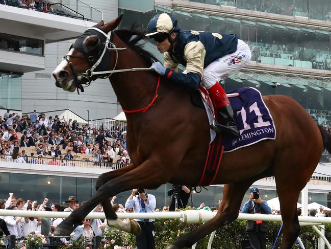 MELBOURNE, AUSTRALIA - NOVEMBER 05: Craig Williams rides #11 Soulcombe to win the Queen's Cup during 2022 TAB Champions Stakes Day at Flemington Racecourse on November 05, 2022 in Melbourne, Australia. (Photo by Robert Cianflone/Getty Images)