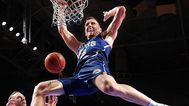 Mitch Creek slam dunks during Adelaide’s NBL grand final series against Melbourne United. Daniel Kalisz (Getty)