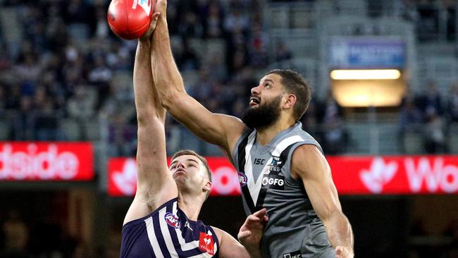 Fremantle’s Sean Darcy contests a tap with Port Adelaide’s Paddy Ryder during the Round 13 match at Optus Stadium in Perth. Picture: AAP Image/Richard Wainwright.