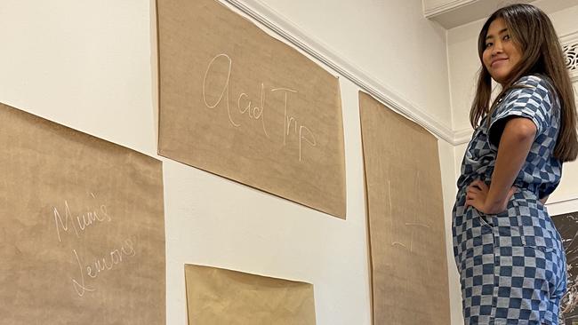 Content creator Jessica Nguyen used brown paper templates to arrange the gallery wall in her Mebourne home.