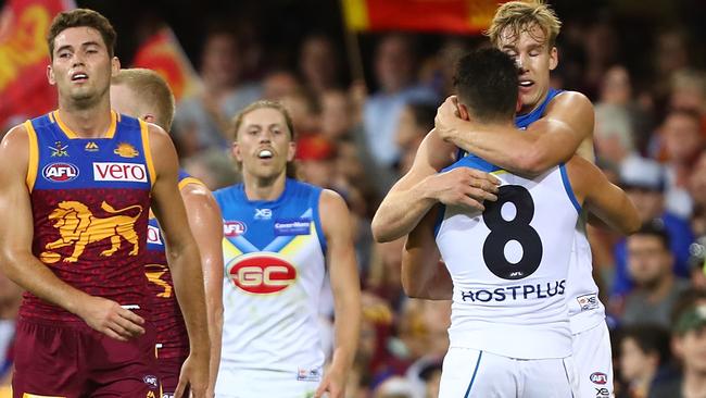 Co-captain Tom Lynch hugs Brayden Fiorini after one of his two goals. Picture: Getty