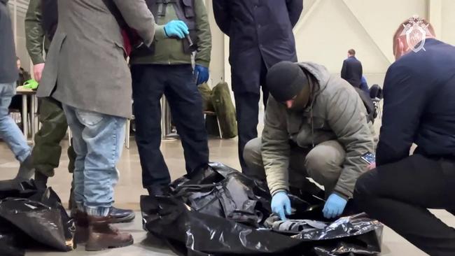 Investigators collect evidence at the scene of the gun attack in the Crocus City Hall concert hall. Picture: AFP