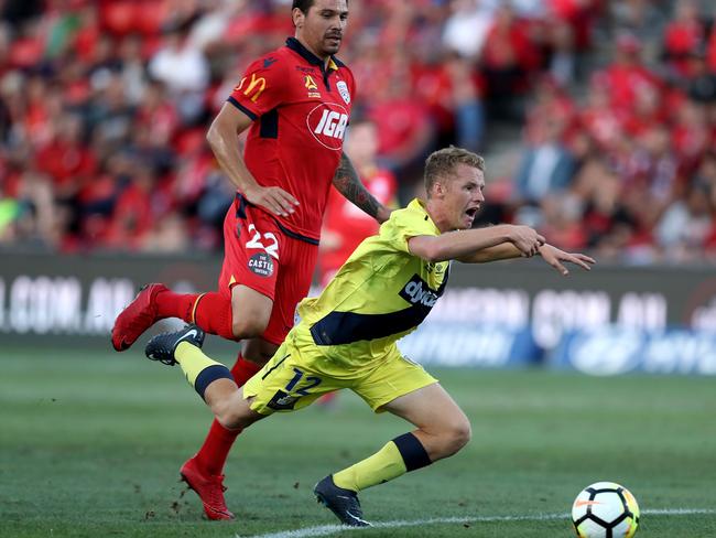 Ersan Gulum of United receives a red card for this tackle on Trent Buhagiar.