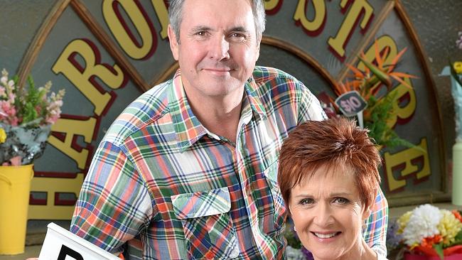 Neighbours cast members Jackie Woodburne and Alan Fletcher celebrating 20 years