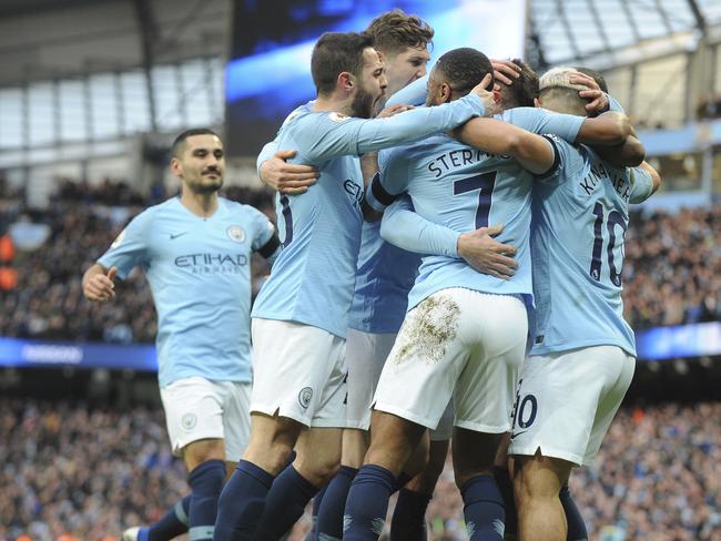 Manchester City's Sergio Aguero, right, celebrates with teammates after scoring his side's third goal during the English Premier League soccer match between Manchester City and Chelsea at Etihad stadium in Manchester, England, Sunday, Feb. 10, 2019. (AP Photo/Rui Vieira)