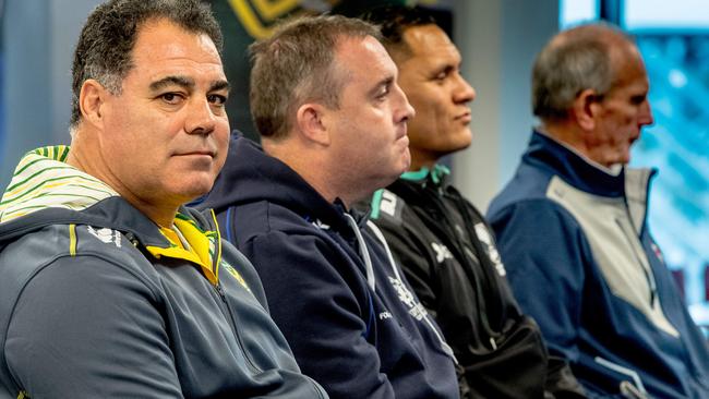 Kangaroos coach Mal Meninga (foreground) wrote a column saying he had no relationship with England coach Wayne Bennett (background).