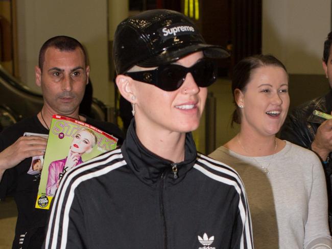 *** FEES APPLY - ONE TIME USE ONLY **Katy Perry touched down in Sydney on Thursday off a flight from London. The singer was dressed down in a Adidas tracksuit and a cap with glasses. NO CREDIT