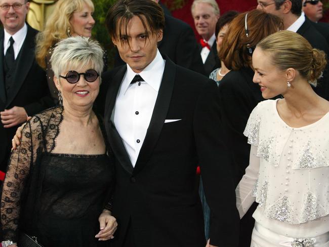 Johnny Depp with his mother Betty Sue Palmer and girlfriend Vanessa Paradis in 2004. Picture: Frank Micelotta/Getty Images