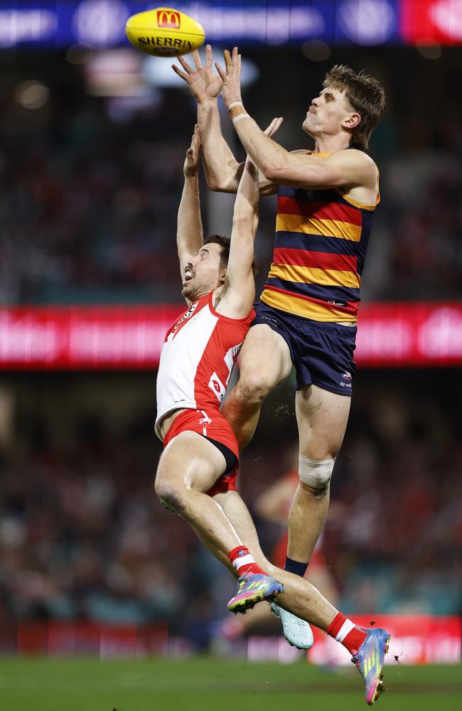 Dan Curtin takes a big mark over Jake Lloyd. Picture: Darrian Traynor/Getty Images