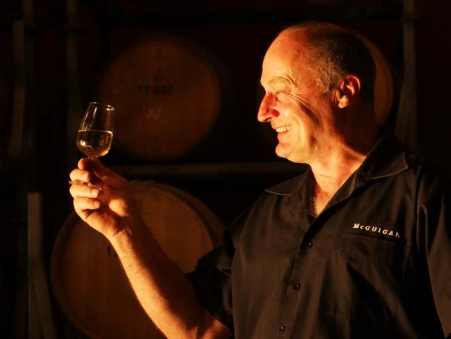 Senior Hunter valley wine maker, Peter Hall amongst the McGuigan vines with a glass of white. Australian wine growing stable McGuigan has again been named among the winners at a prestigious international wine-making competition, International Wine Challenge. Pic - Sam Mooy