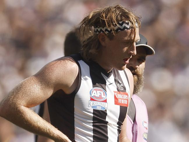 MELBOURNE, AUSTRALIA - SEPTEMBER 30: Nathan Murphy of the Magpies leaves the field with trainers during the 2023 AFL Grand Final match between Collingwood Magpies and Brisbane Lions at Melbourne Cricket Ground, on September 30, 2023, in Melbourne, Australia. (Photo by Daniel Pockett/AFL Photos/via Getty Images)