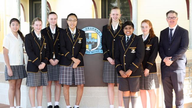 Townsville Grammar School academic achievers Naomi Kutash (Dux Year 6), Phillipa Dowling (Dux Year 7), Millie Andrews (Dux Year 9), Sul-Gi Stephanie Kim (Dux Year 12), Emily Price (Dux Year 10), Dylan Rao (Dux Year 6), Kara Banks (Dux Year 11) and Principal Timothy Kelly. 