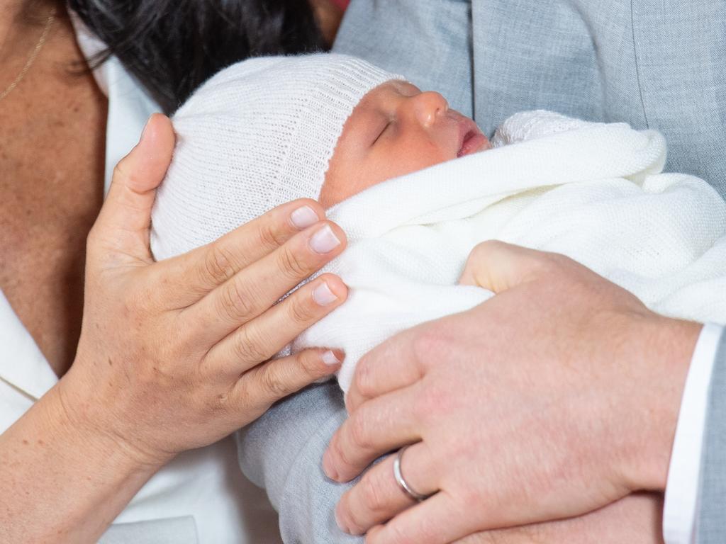 Baby Archie was swaddled and wearing a white knitted hat. Picture: Dominic Lipinski