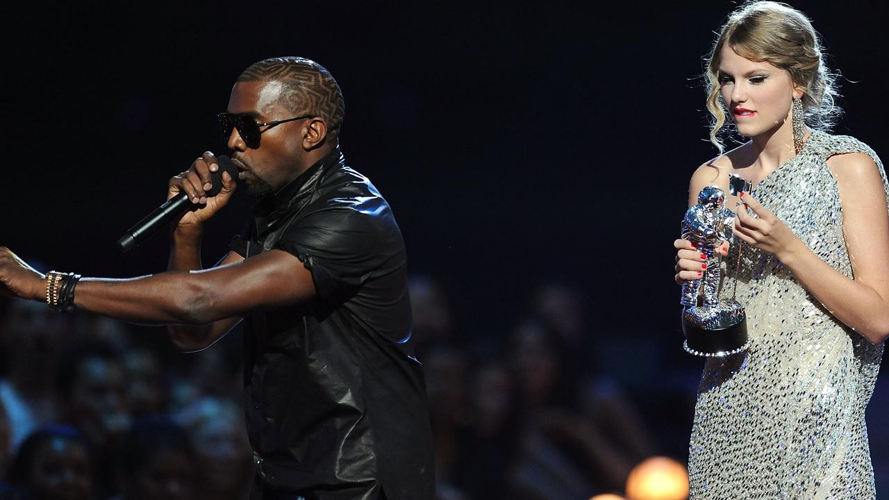 Kanye West takes the microphone from Taylor Swift and speaks onstage during the 2009 MTV Video Music Awards. Picture: Kevin Mazur/WireImage