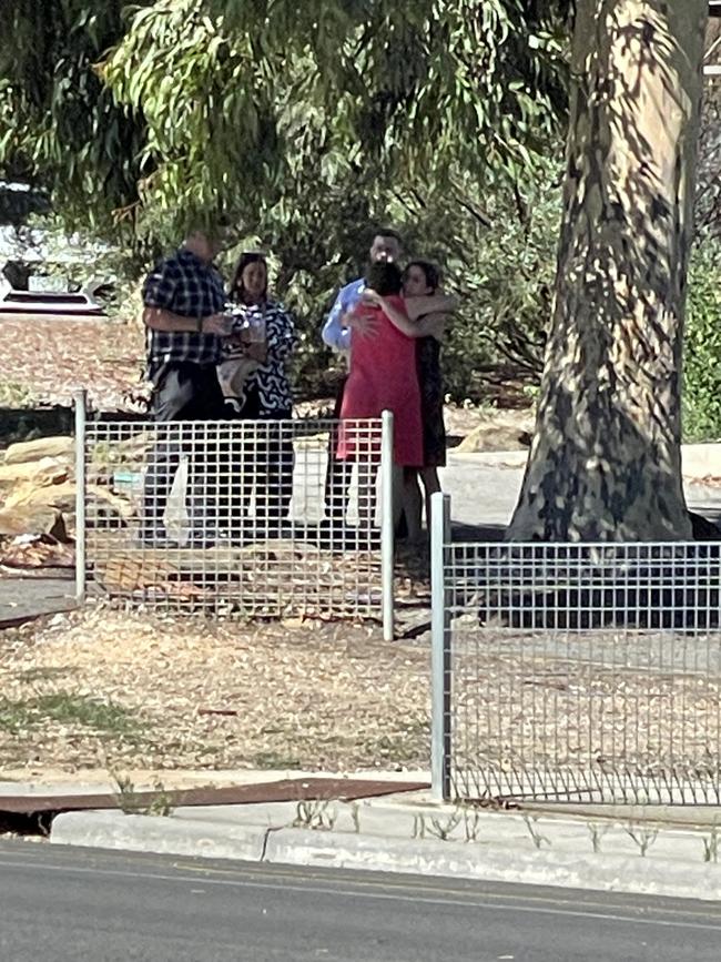 Staff at Bendigo South East Secondary College comforting each other..