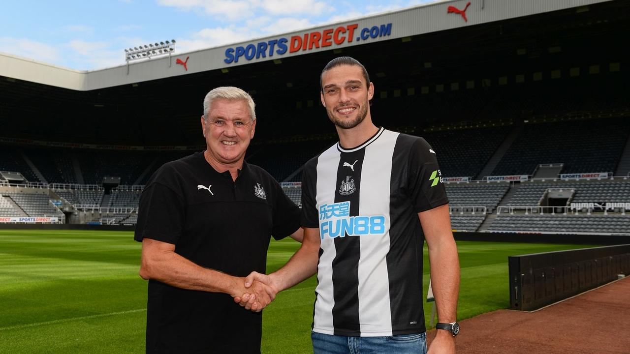 Andy Carroll with manager Steve Bruce of Newcastle United.