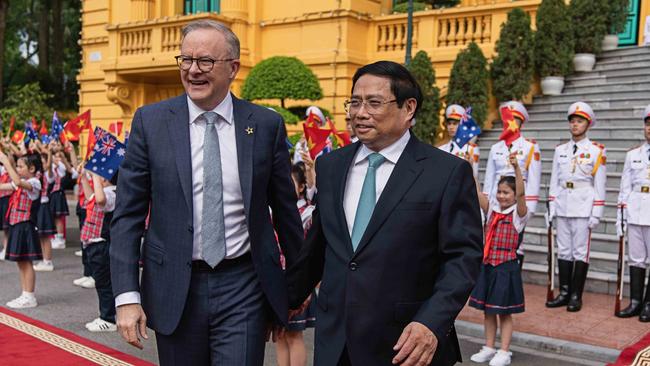 Prime Minister Anthony Albanese with Vietnamese leader Pham Minh Chinh outside the Presidential Palace in Hanoi. Picture: Twitter/@AlboMP