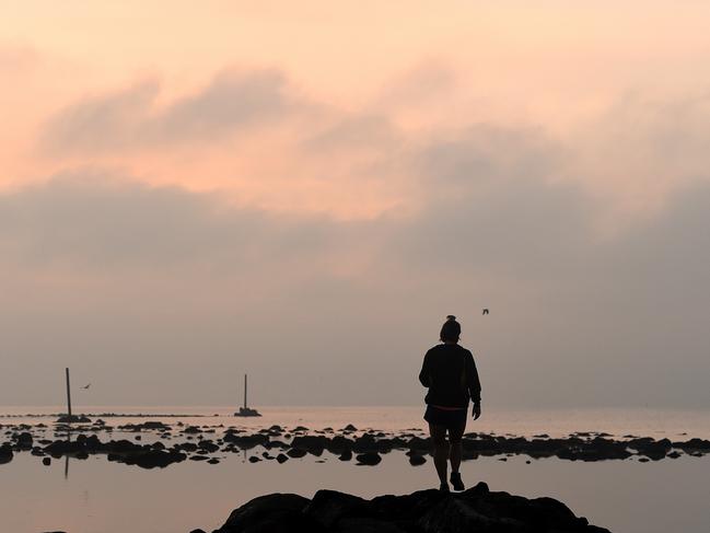 A misty start before a hot day in Melbourne. Picture: Nicole Garmston