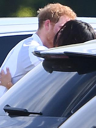 Markle and Harry pictured kissing earlier this year. Picture: James Whatling/Mega