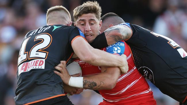 SYDNEY, AUSTRALIA - APRIL 14:  Zac Lomax of the Dragons is tackled during the round six NRL match between Wests Tigers and St George Illawarra Dragons at Campbelltown Stadium, on April 14, 2024, in Sydney, Australia. (Photo by Matt King/Getty Images)