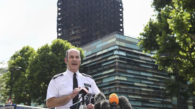 Metropolitan Police Commander Stuart Cundy speaking outside the charred tower in west London. Picture: Victoria Jones/PA via AP.