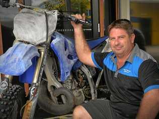 REUNITED: As the storms started raging early Thursday morning thieves broke into Mathew Brown's shop, stealing his custom racing dirt bike and some other goods, but thanks to social media he was quickly reunited with the bike. Picture: Patrick Woods