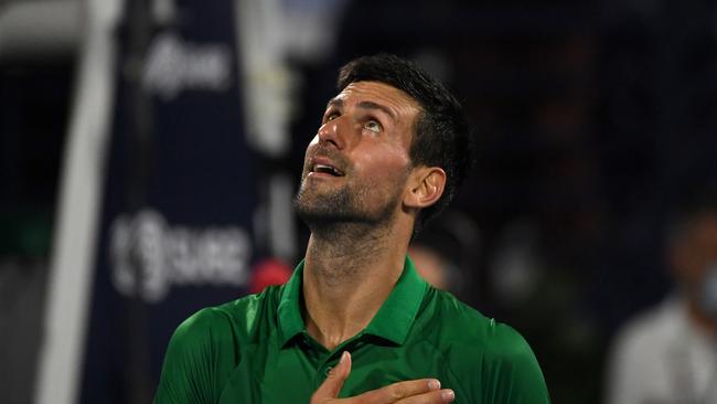 DUBAI, UNITED ARAB EMIRATES - FEBRUARY 23: Novak Djokovic of Serbia reacts after beating Karen Khachanov of Russia in the second round match during day 10 of the Dubai Duty Free Tennis at Dubai Duty Free Tennis Stadium on February 23, 2022 in Dubai, United Arab Emirates. (Photo by Martin Dokoupil/Getty Images)