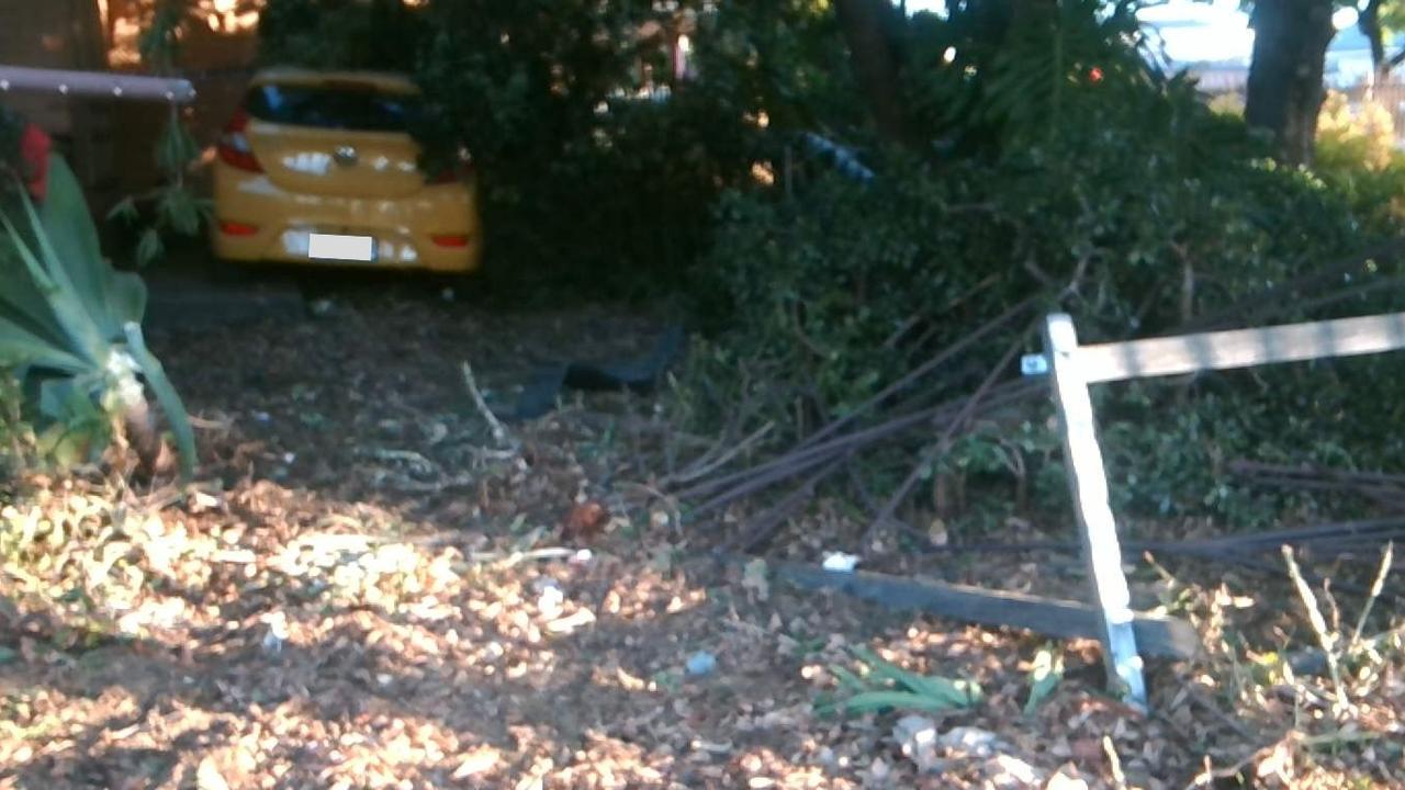 A 66-year-old woman has crashed through a fence and house on Watson Ave. Picture: SAPOL