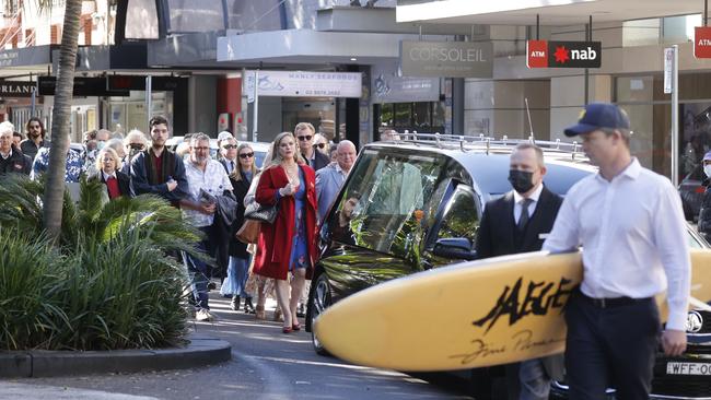 Surfing pioneer Barry Bennett was honoured with a procession through the Manly CBD on Wednesday after he was farewelled at a funeral in St Matthews Anglican Church. Mr Bennet, credited with helping establish the surfing industry in Australian from his factory and shop at Brookvale, was 90. Picture: Tim Hunter.