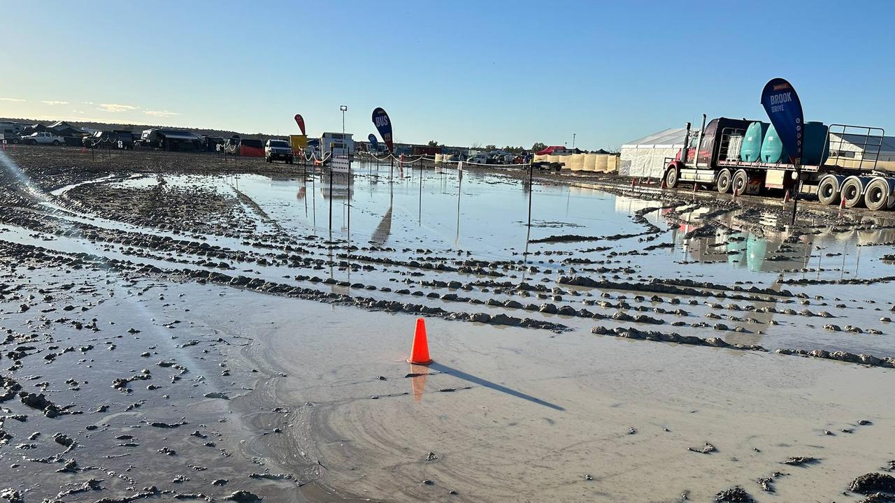 About 6000 patrons have their boots in the mud camping out at the remote Big Red Bash festival at Birdsville, QLD. Picture: Queensland Ambulance Sercive / Facebook