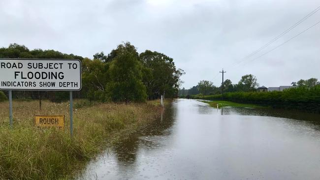 Headlam Road in Moss Vale has been inundated during the heavy rain. Picture: Phillip Minnis