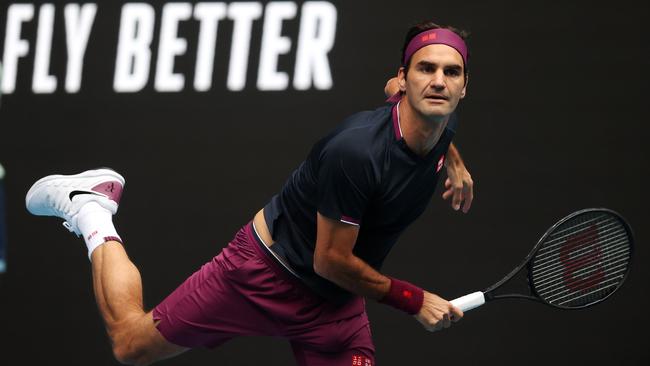 Roger Federer cranks up his serve against American Steve Johnson during round one at the Australian Open. Picture: Michael Klein