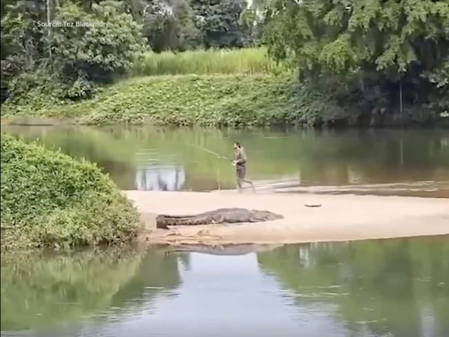 Later, the man casually walked right by the croc. Picture: Supplied.