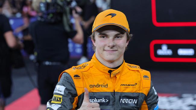 McLaren's Australian driver Oscar Piastri celebrates after finishing with the third best time during the qualifying session for the Abu Dhabi Formula One Grand Prix at the Yas Marina Circuit in the Emirati city on November 25, 2023. (Photo by Giuseppe CACACE / AFP)