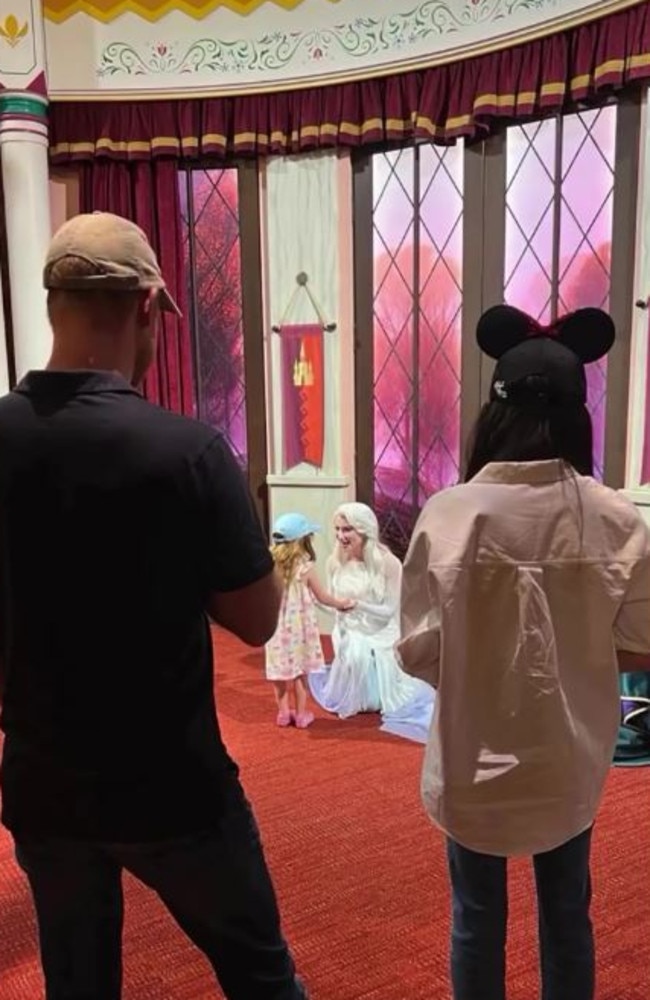 The Duke and Duchess watch on as Lilibet is greeted by a Disney Princess. Picture: Instagram